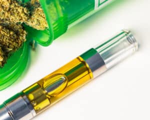 Full gram vape pen with medical marijuana up-close isolated on white background. An alternative medicine prescribed to medical marijuana patients.